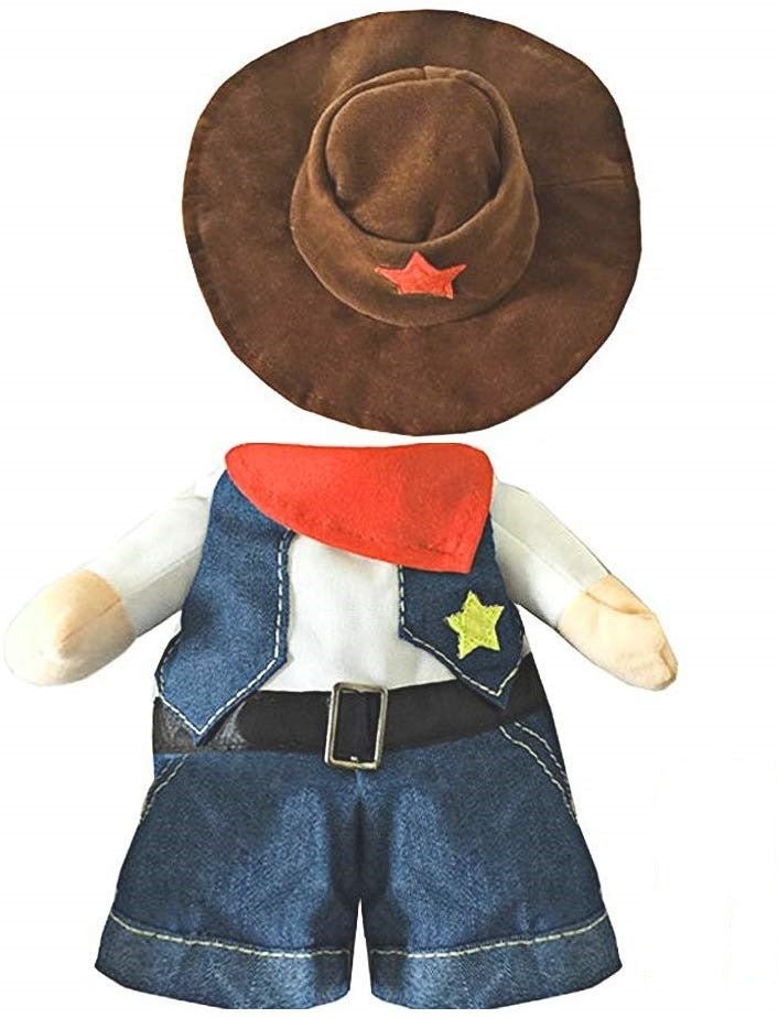 Doll wearing a cowboy outfit with a hat, vest, and shorts on a white background